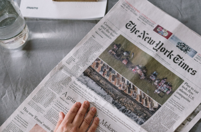 A front page spread of The New York Times on a table