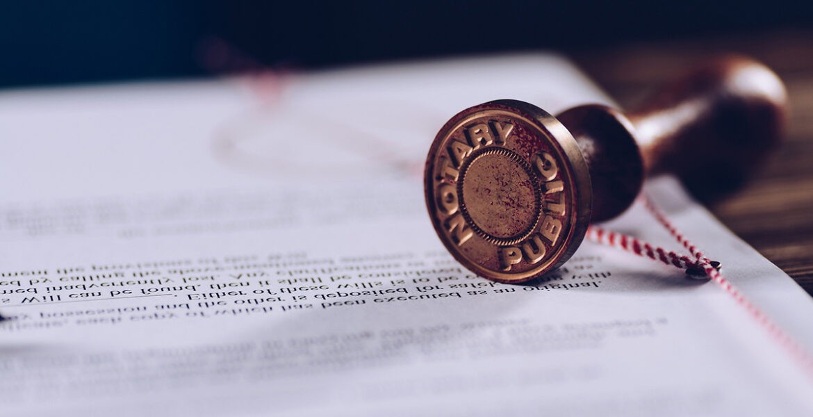Picture of a Notary Seal Ebosser sitting on a document.
