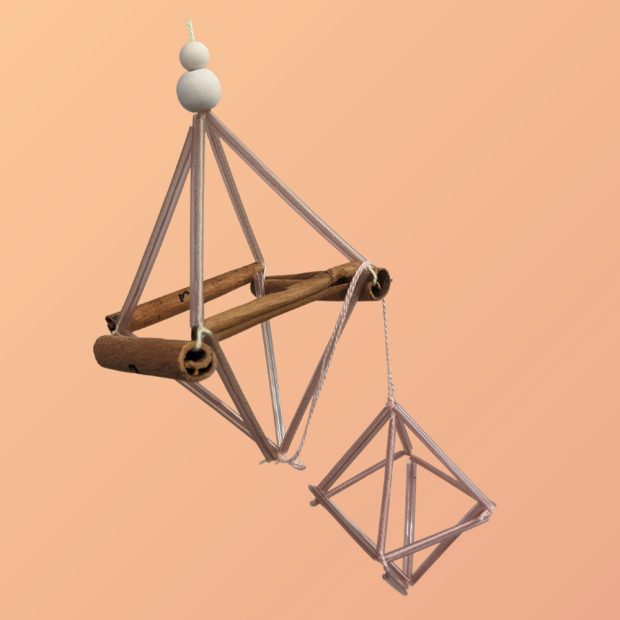 Image of diamond shaped ornament created with cinnamon sticks, beads, and straws