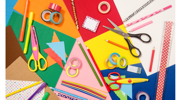 Arts and Crafts supplies messy on a colorful background
