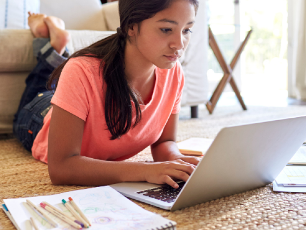 Student doing homework on a laptop