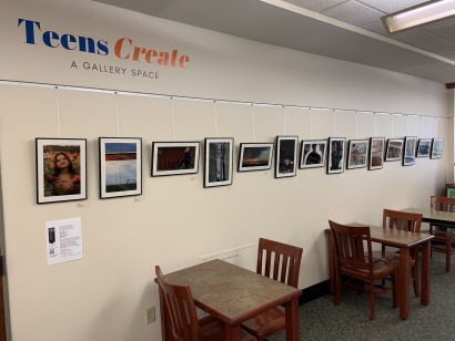 Image of Teen gallery wall with photographs hanging in a row