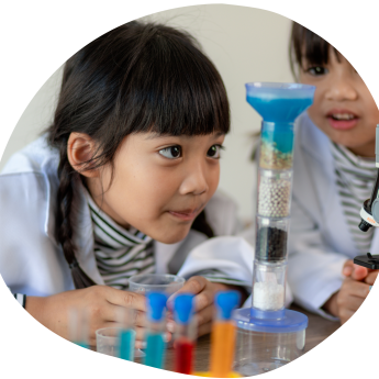 Child observing a STEM experiment