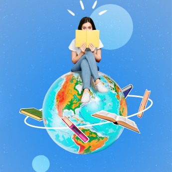 Girl sitting on globe reading a book
